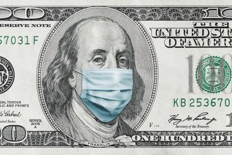 COVID-19 coronavirus in USA. Hundred golden dollar money bill with face mask. Stock Photos
