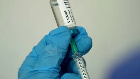Covid-19 Coronavirus Vaccine Injection Is Prepared In Syringe By Nurse Stock Footage