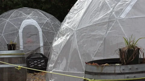 COVID 19 dining domes over restaurant patio in winter during pandemic Stock Footage 142448968