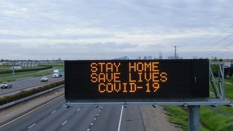 COVID-19 DRONE SAVE LIVES CORONAVIRUS WARNING SIGNS Stock Footage