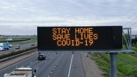 COVID-19 DRONE SAVE LIVES CORONAVIRUS WARNING SIGNS Stock Footage