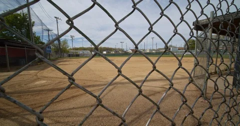 Covid-19, empty baseball fields. Closed, locked, no kids. Vídeos de archivo 129649110