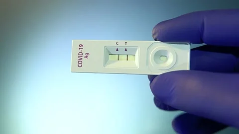 Covid 19 fast test shows positive Stock Footage 153776924
