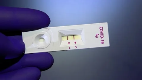 Covid 19 fast test shows positive result Stock Footage 153777017