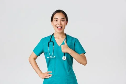 Covid-19, healthcare workers, pandemic concept. Smiling upbeat, confident female Stock Photos