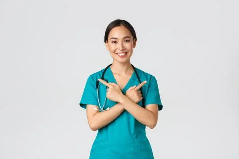 Covid-19, healthcare workers, pandemic concept. Smiling beautiful asian nurse Stock Photos