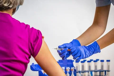 COVID-19 immunization. Vaccinating the elderly. Stock Photos