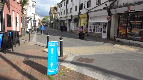 Covid 19 Keep Your Distance Signs in High Street, Poole, Dorset, UK Stock Footage 141616732