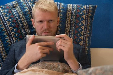 Covid-19 lockdown, work at home from bed Stock Photos
