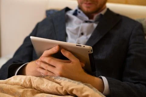 Covid-19 lockdown, work at home from bed Stock Photos
