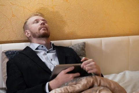 Covid-19 lockdown, work at home from bed Foto stock