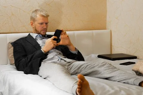 Covid-19 lockdown, work at home from bed Stock Photos