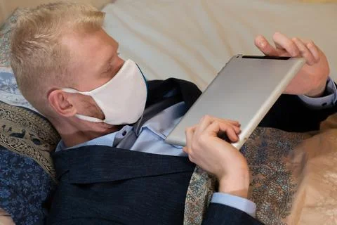 Covid-19 lockdown, work at home from bed Stock Photos