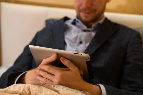 Covid-19 lockdown, work at home from bed Stock Photos
