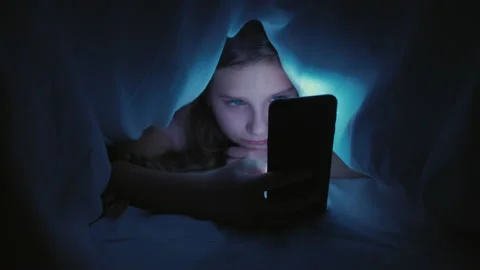 Covid-19 outbreak lockdown bored girl smartphone Stock Footage 130365063