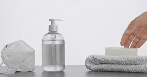 Covid-19 Prevention Set With Mask. Male Hand Picks Soap In Slow Motion Stock Footage 136414551