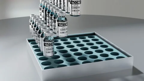 Covid-19, SARS-CoV-2, coronavirus vaccine vials falling into wholesale box  Stock Footage 149253797