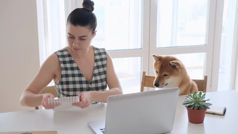 Covid-19 self-isolation and working from home concept. Woman using laptop Stock Footage 128982138