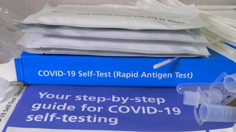 Covid-19 self-test (rapid antigen) kit - reverse dolly shot. Video stock 156401334