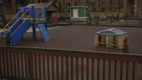 Covid-19 Series -  Empty Playground Closed with Caution Tape Stockbeeldmateriaal 128128582