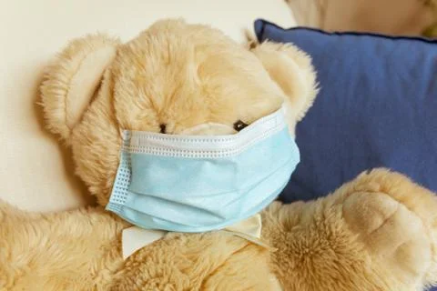 Covid-19, teddybear with surgical mask, soft toy with medical protection Stock Photos