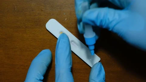 Covid-19 test kit showing positive Video stock 171409550