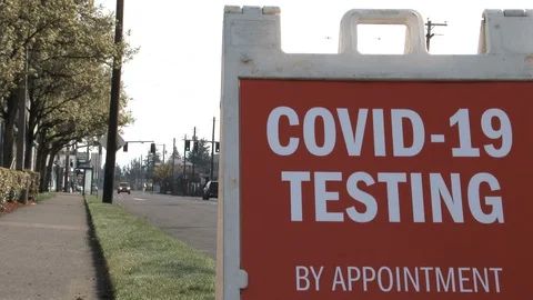 COVID-19 Testing By Appointment Sign On Street Stock Footage 127710701