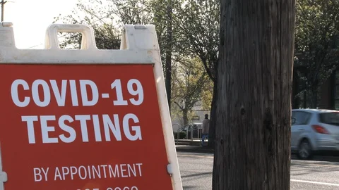COVID-19 Testing Sign Posted On Street Stock Footage 127711766