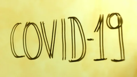 Covid-19 text on mirror cleaning with disinfectant spray vaccine concept Stock-Footage 127564352