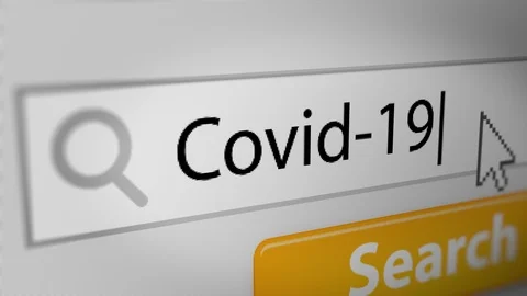 "Covid-19" Typing into Search Engine on Computer Screen Stock Footage 127556020
