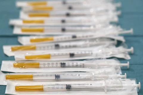 COVID-19 vaccination center, syringes with corona serum, Moderna COVID-19 Stock Photos