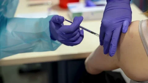 COVID-19 vaccination program with the Pfizer BioNTech vaccine in Poland Stock Footage 145871996