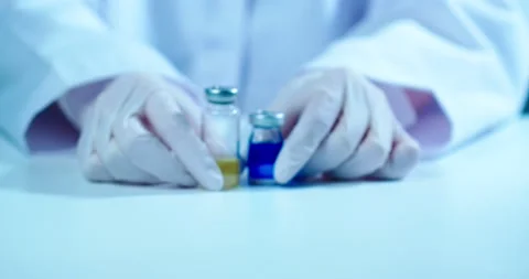 COVID-19 vaccine development and choice. Close up video of doctor showing Video stock 150955068