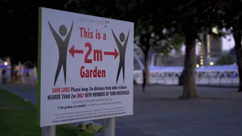 A Covid-19 warning 2 meter Social Distancing sign in London in 2020 Stock Footage 131522059