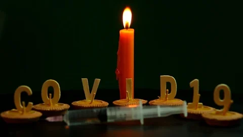 COVID-19 words with fire flame , in door Chiangmai Thailand Stock Footage 127408926