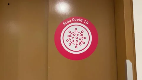 COVID Area red warning sticker close-up in Elevator door in Clinic / Stock Footage 139993455