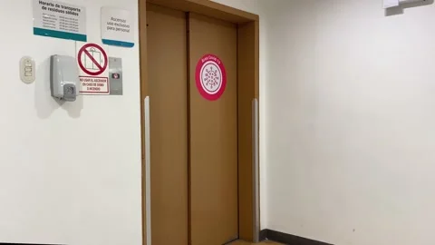 COVID Area red warning sticker in Elevator door in Clinic / Hospital - Stock Footage 139993458