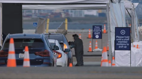 Covid Drive-Through Test being administered Stock Footage 129523164