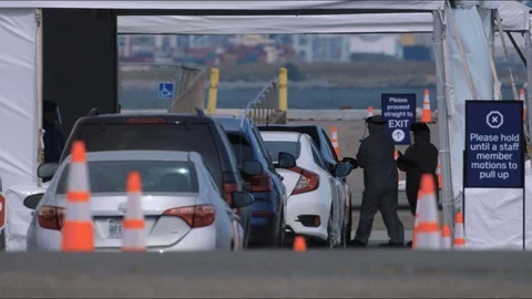 Covid Drive-Through Test being administered Stock Footage 129523235