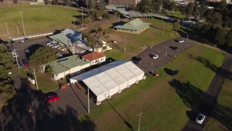 Covid Drive Through Testing Center Aerial Drone Sunny Afternoon - Castle Hill Stock Footage 156722628
