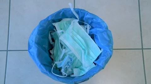 Covid garbage. Pollution mask. Used disposable mask. Coronavirus Garbage Video stock 148432578