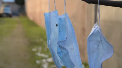 Covid garbage. Pollution mask. Used disposable mask. Coronavirus Garbage Video stock 148432739