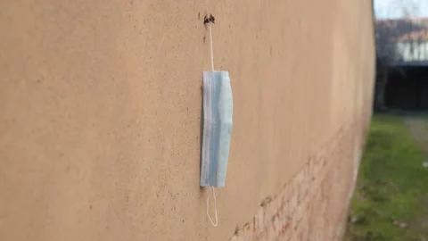 Covid garbage. Pollution mask. Used disposable mask. Coronavirus Garbage Video stock 148432787