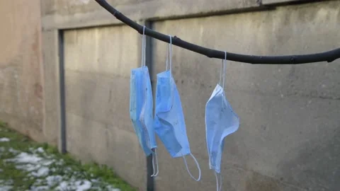 Covid garbage. Pollution mask. Used disposable mask. Coronavirus Garbage Video stock 148432805