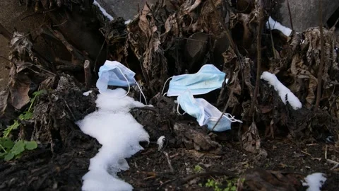 Covid garbage. Pollution mask. Used disposable mask. Coronavirus Garbage Video stock 148432807