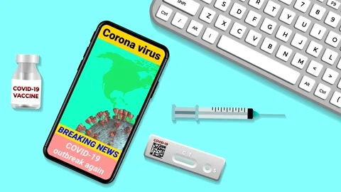Covid outbreak again news in mobile phone Stock Footage 229537440