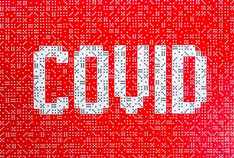 COVID spelled with dice Stock Photos