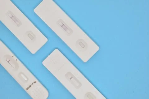Covid test kit on blue background Foto stock