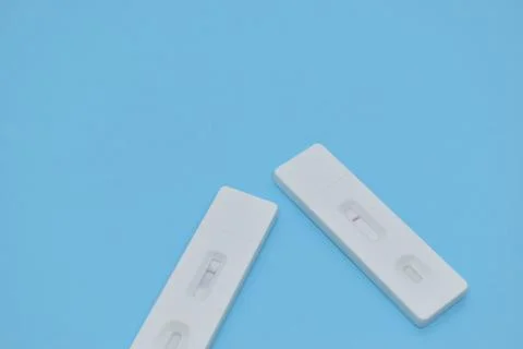 Covid test kit on blue background Stock Photos