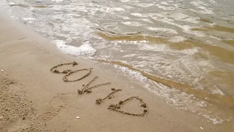 Covid text on the sand on the beach. Stock Footage 158991230